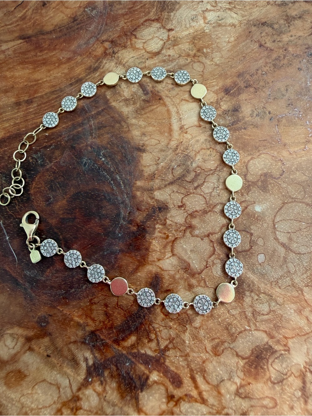 14k Gold and natural diamond disc bracelet.